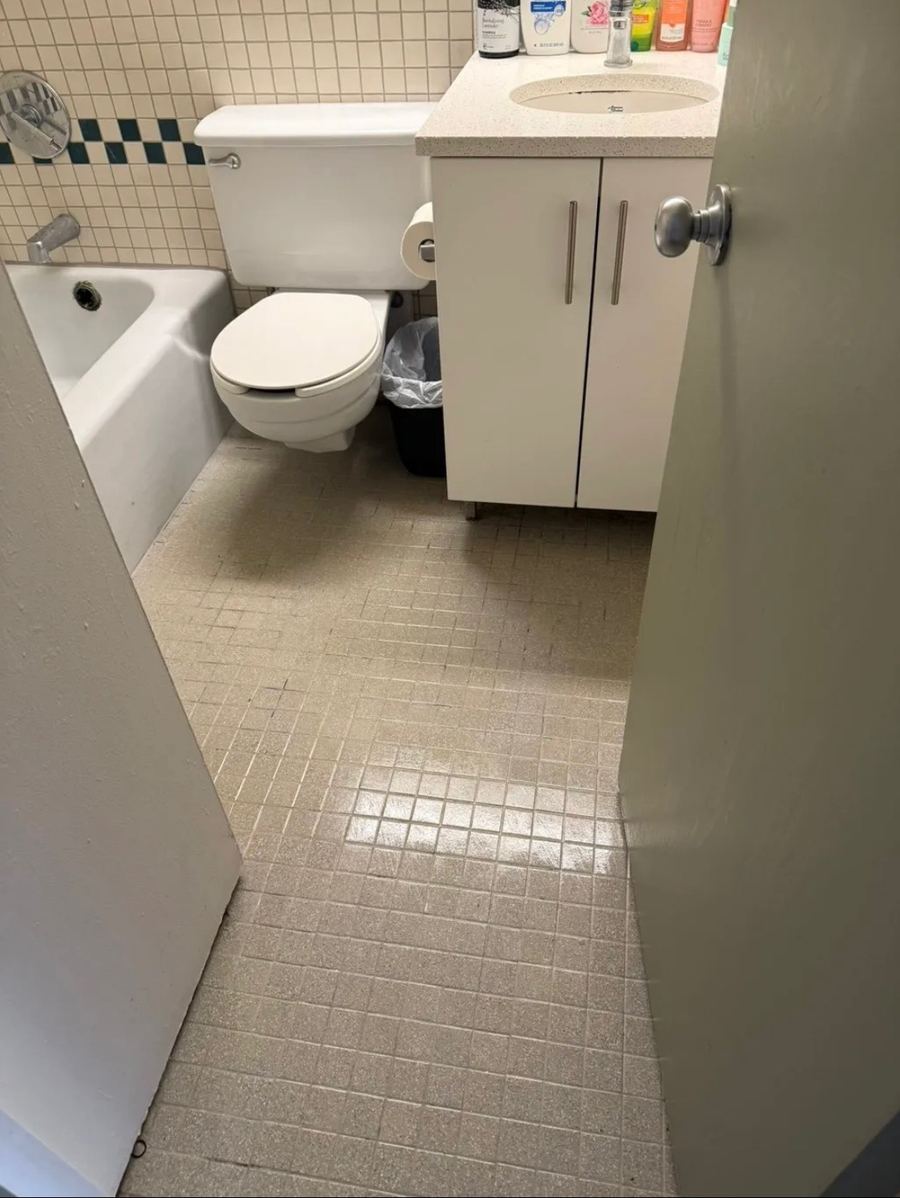 Bathroom tile floor bright and spotless after cleaning