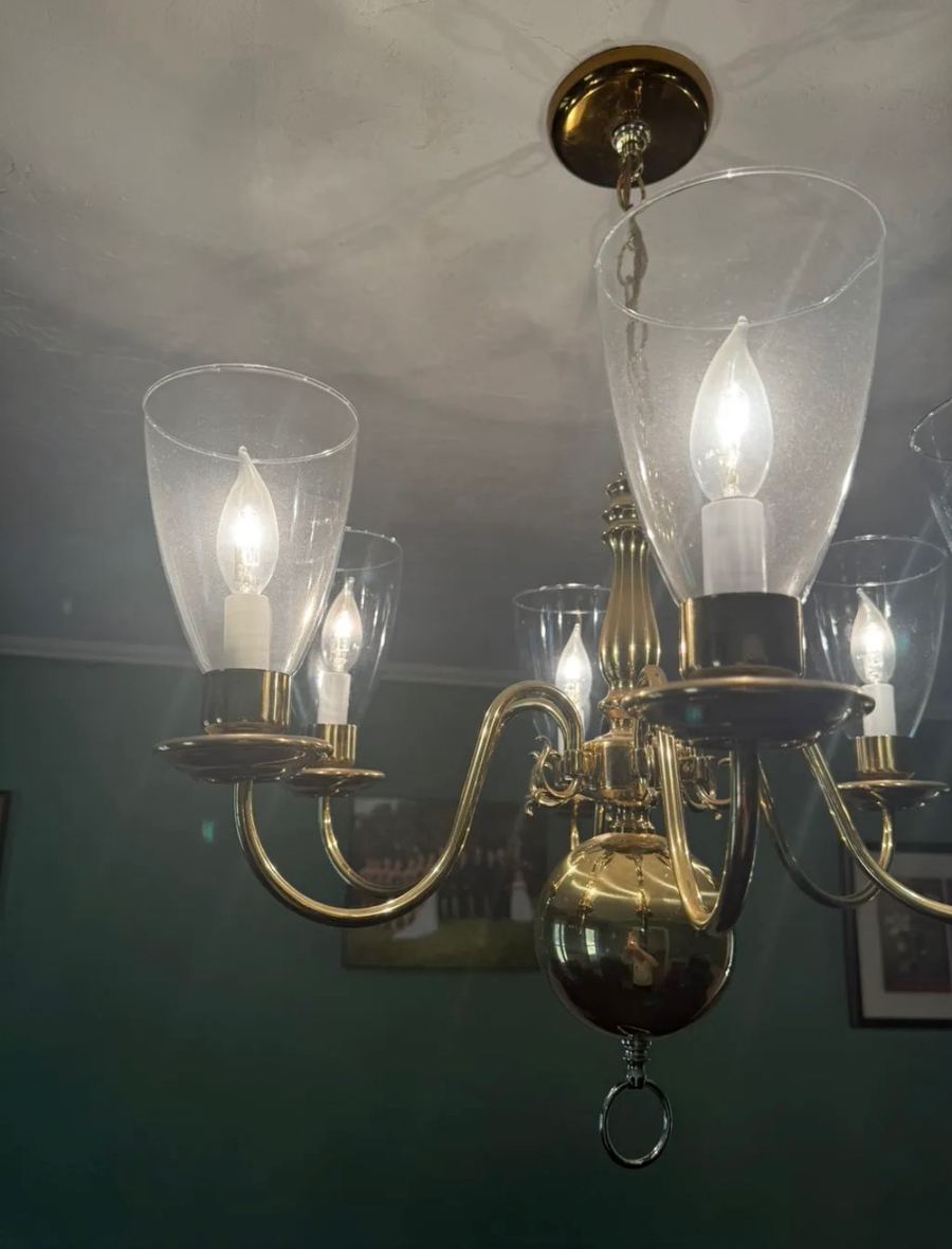 Dusty brass chandelier before polishing