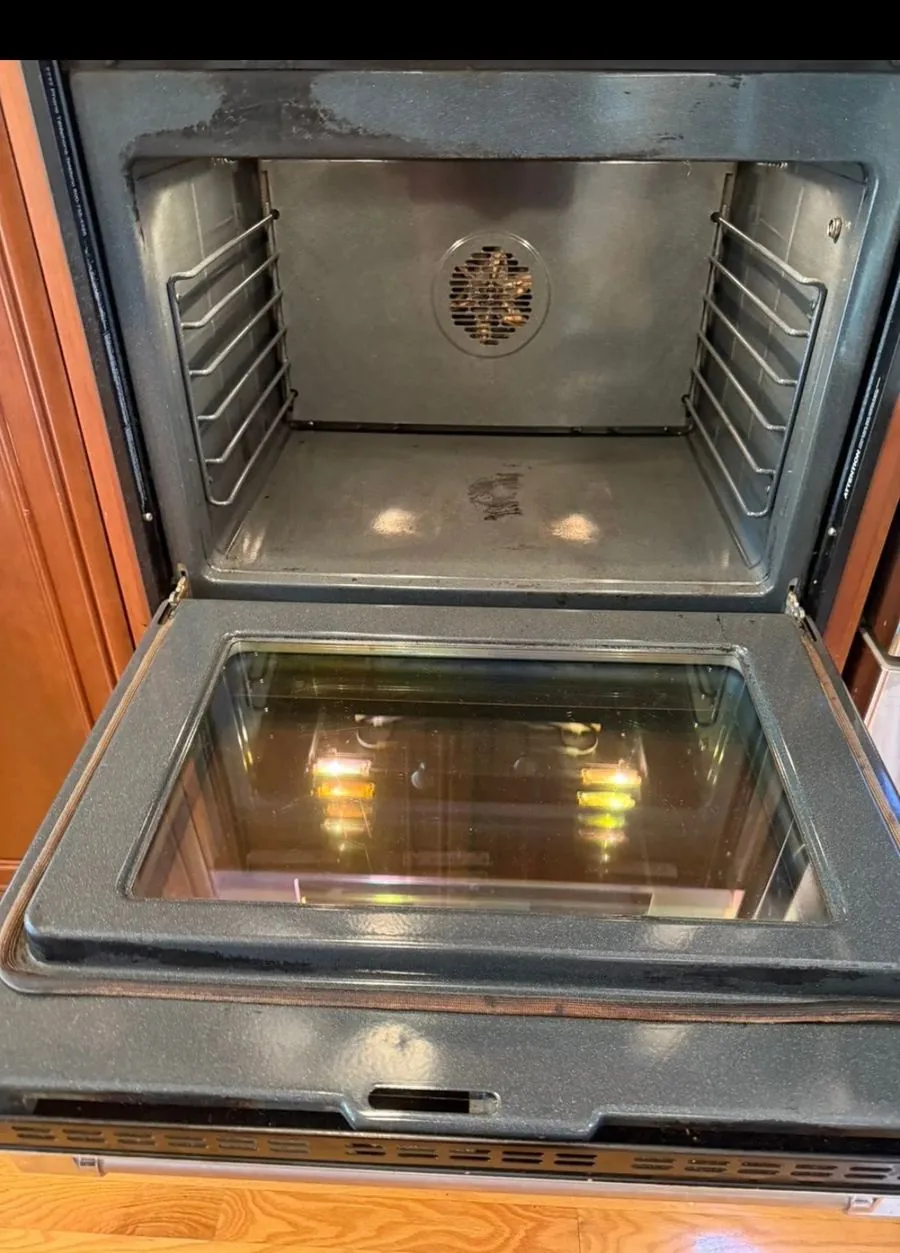 The same oven shining after a GA Cleaning Service deep clean