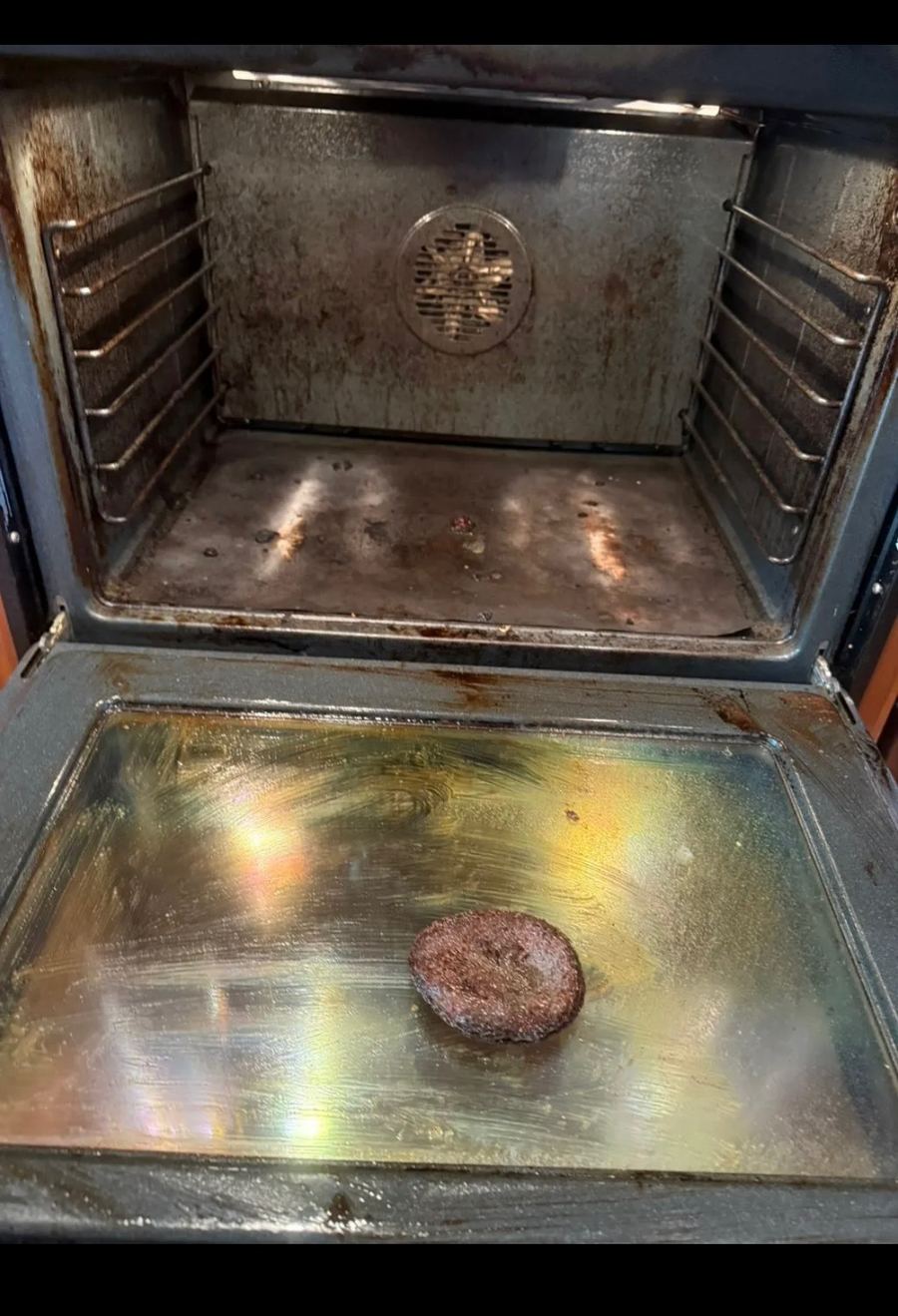 Oven caked with burnt residue before deep cleaning
